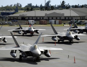 F-22 Raptors sit on the flight line