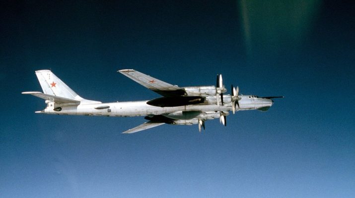An air-to-air right side view of a Soviet Tu-95RTs Bear D strategic bomber